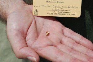 Terry Staggs holding 2.95 carat brown diamond rough