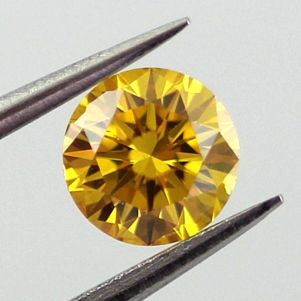 Pair of Fancy Vivid Orangy Yellow Diamond, Round, 0.60 carat, SI2- C